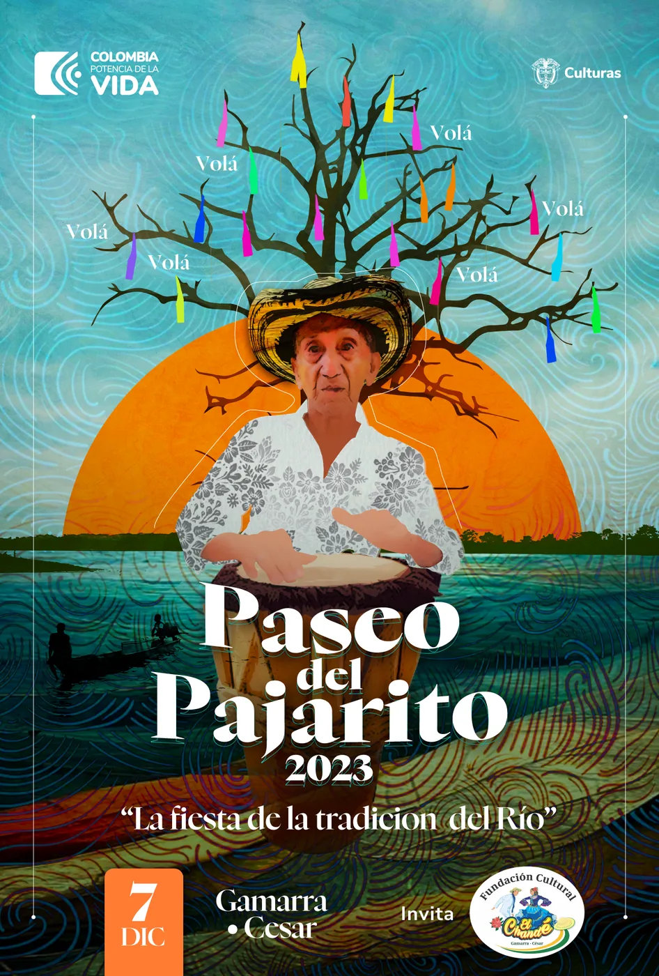 Afiche de El Paseo del Pajarito 2023, "La fiesta de la tradición del río", con un tamborero junto al río Magdalena al atardecer.